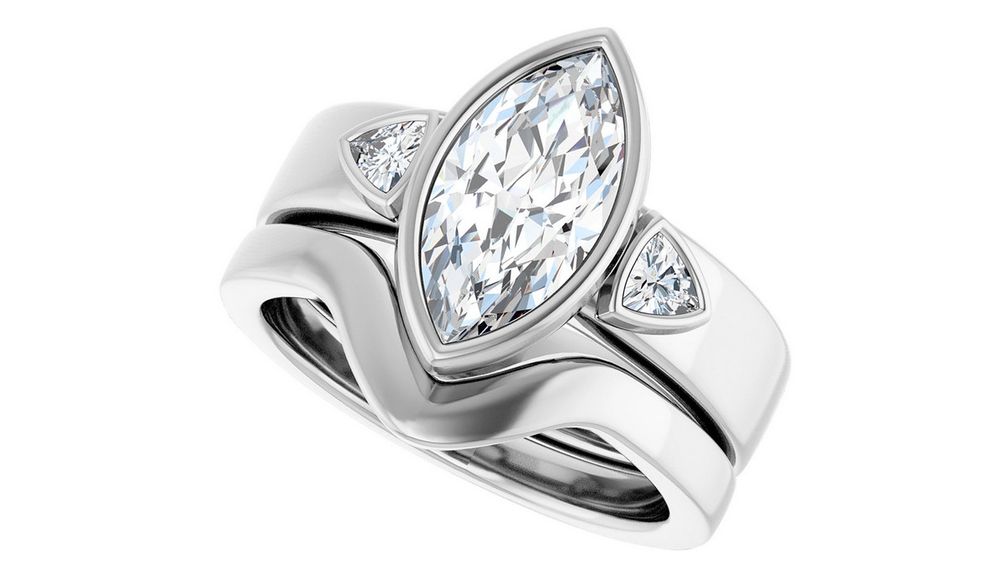 Кольцо от Stuller из 14-каратного белого золота с бриллиантом огранки маркиза, окруженным бриллиантами огранки триллион Кольцо от Stuller из 14-каратного белого золота с бриллиантом огранки маркиза, окруженным бриллиантами огранки триллион