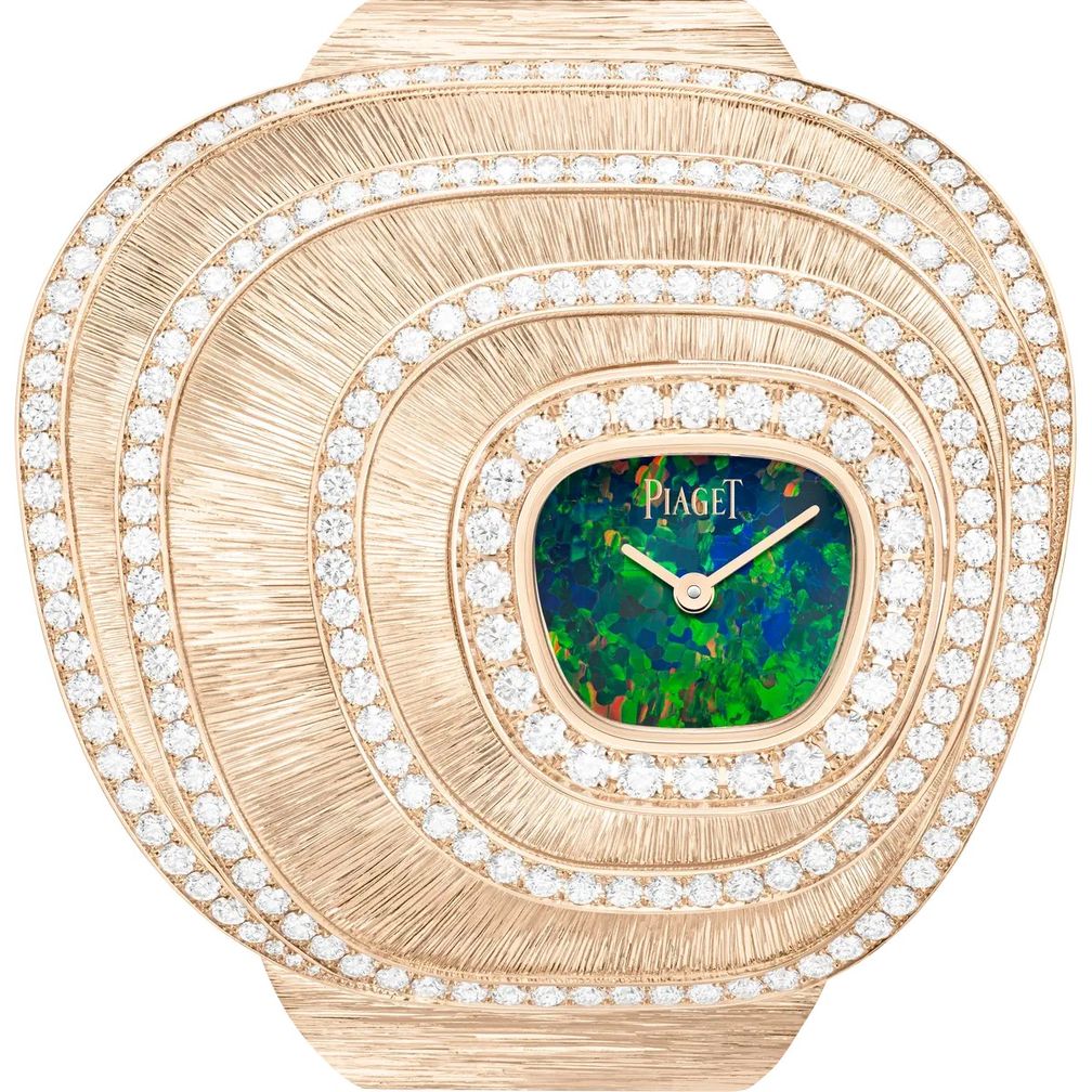 Часы-манжета высокого ювелирного искусства от Piaget из золота с бриллиантами и опалом. Фото: Piaget Часы-манжета высокого ювелирного искусства от Piaget из золота с бриллиантами и опалом. Фото: Piaget