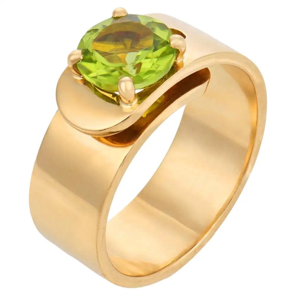 Кольцо-пряжка с перидотом и желтым золотом 18 карат работы Дин Вана для Cartier, 1990 год 